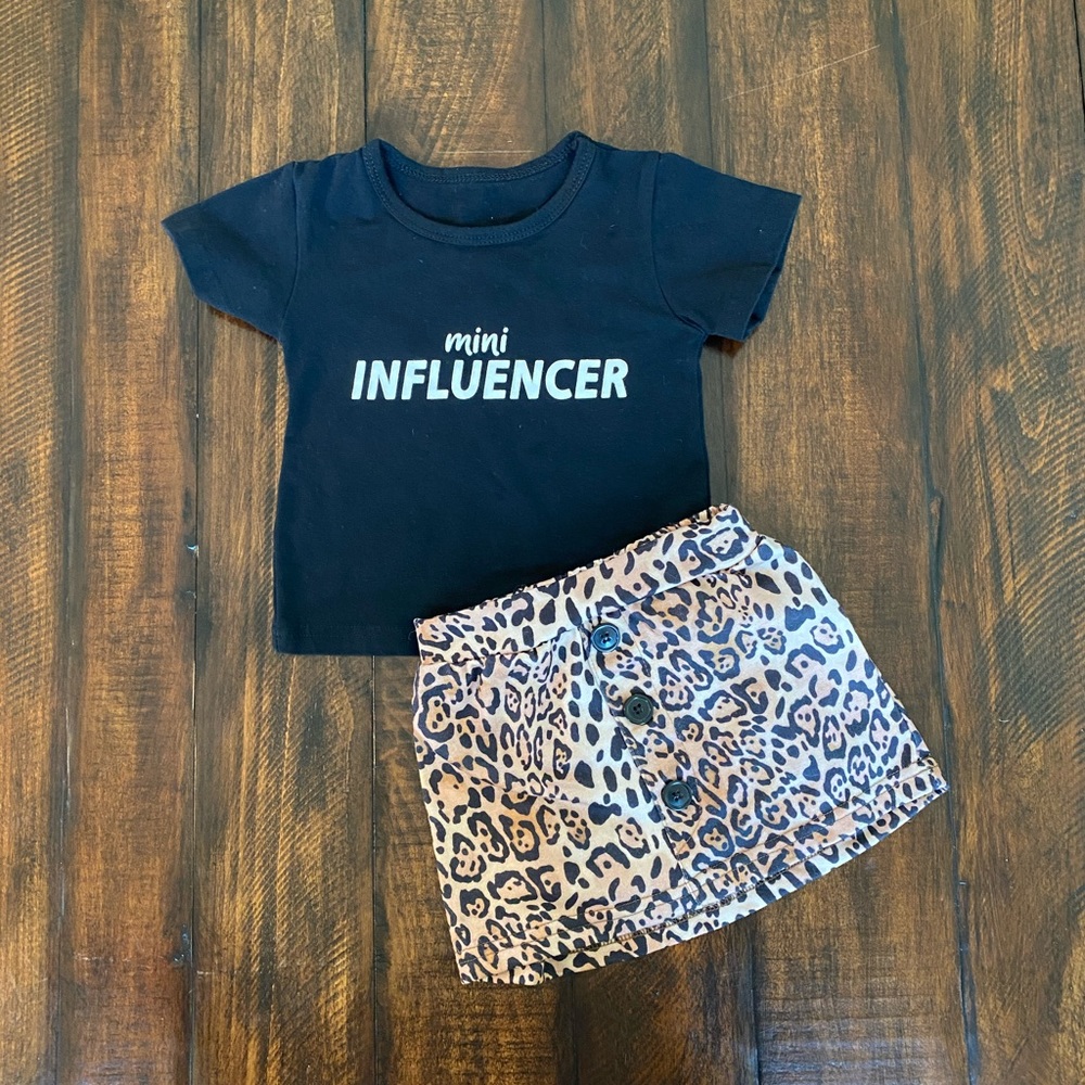 Adorable black shirt with a leopard skirt outfit